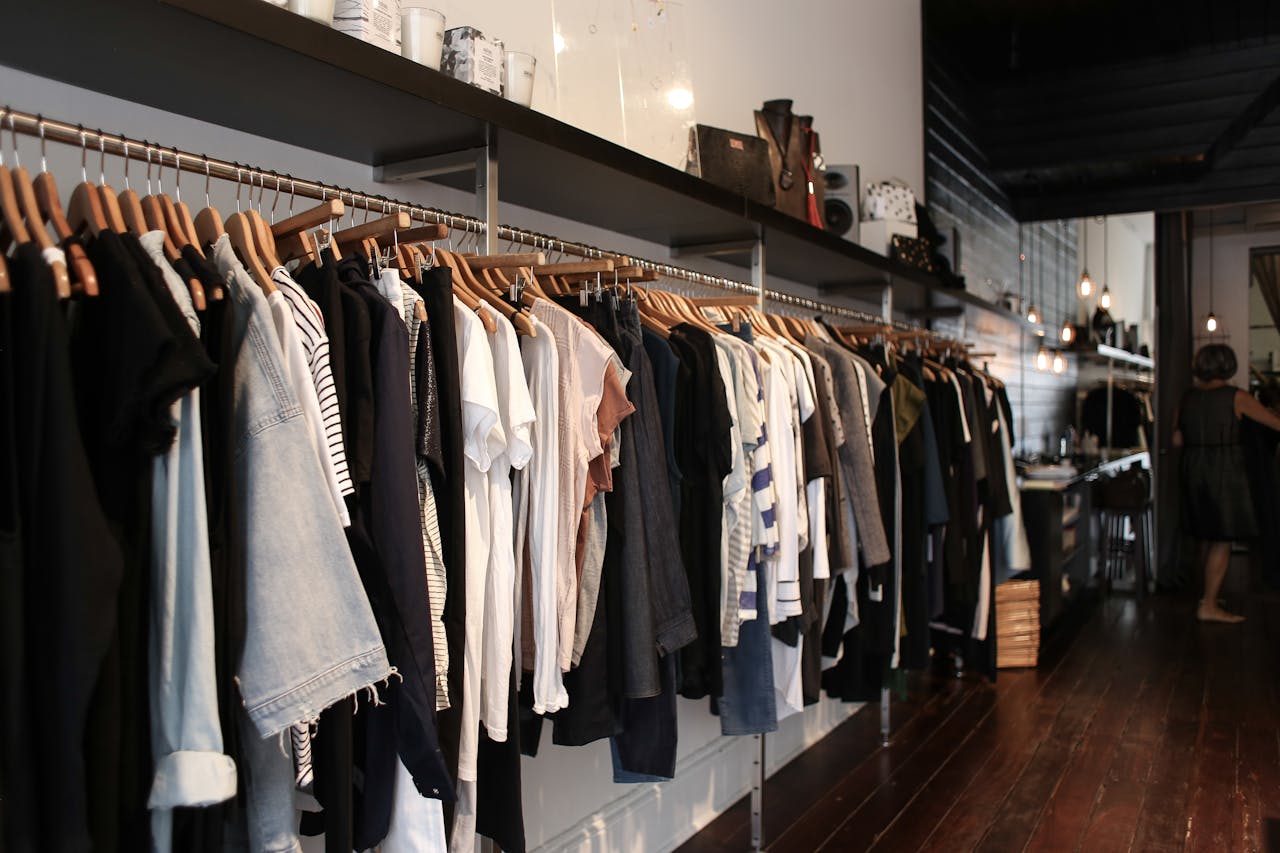 services-02 Explore trendy fashion displayed in an elegant boutique setting, showcasing diverse clothing styles.